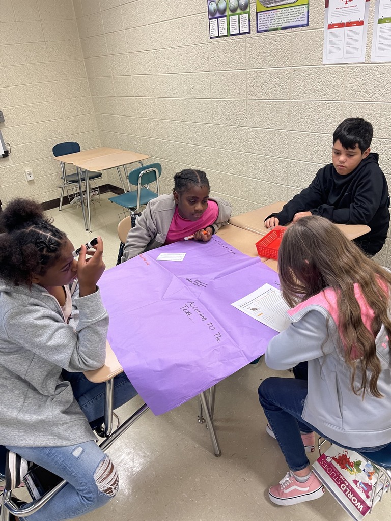 Students drawing on placemat